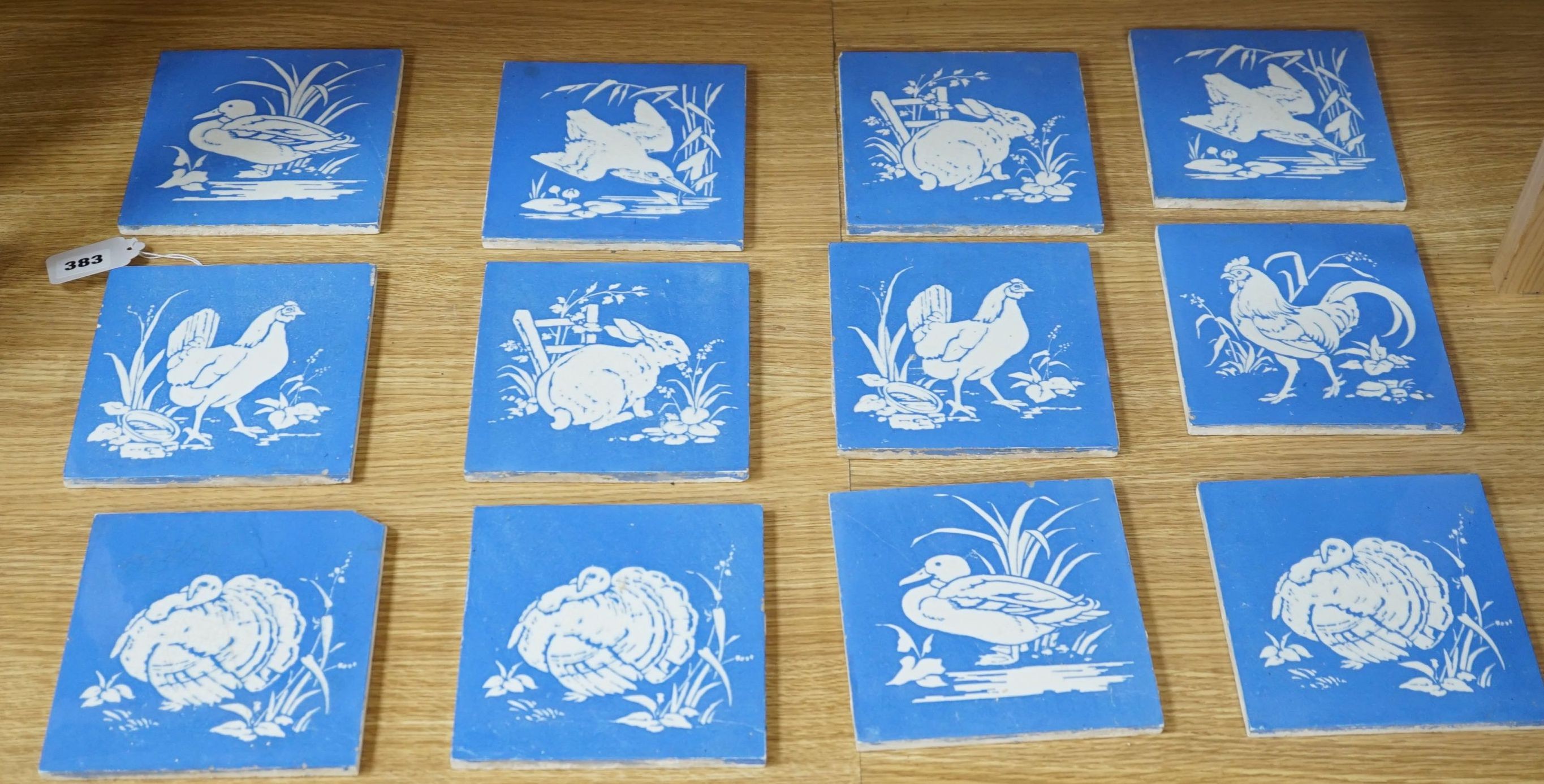 A collection of twelve Mintons China Works blue and white bird tiles, 15cms x 15cms square (each tile).